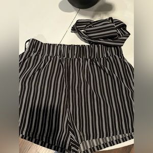 Black and white tie shorts . A silk like material size medium